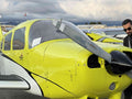 Instructor and student beside a Piper Warrior before a 90-minute discovery flight at Van Nuys Airport, Los Angeles