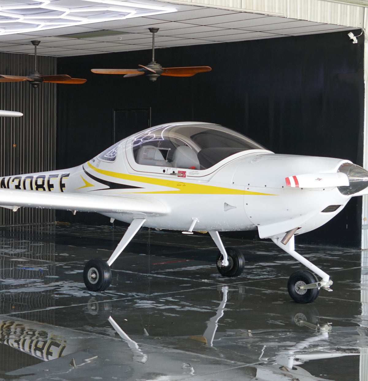 Diamond DA20 N308EF side view in the hangar