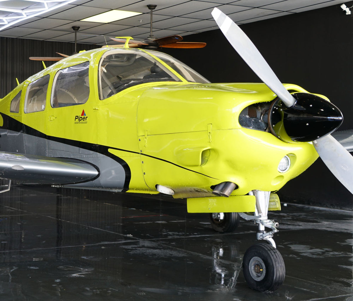 Piper Arrow cowling and propeller in the hangar