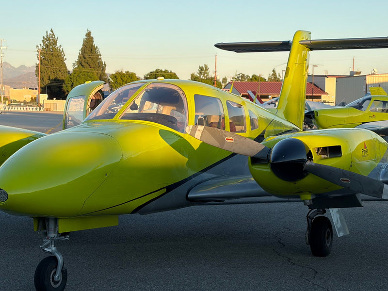 Piper Seminole N311EF, right front quarter, at sunset
