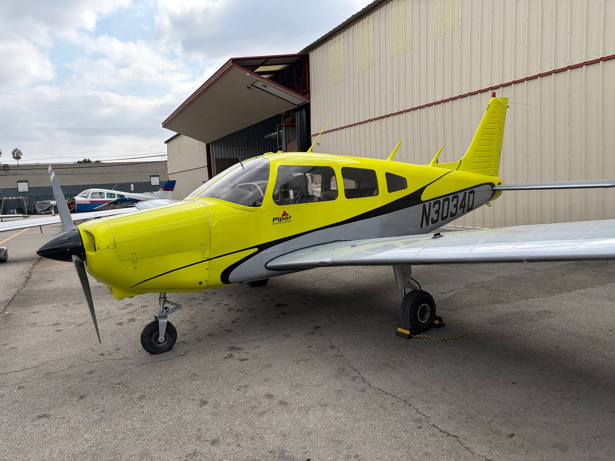 Piper Warrior N3034Q, front quarter, by the hangar