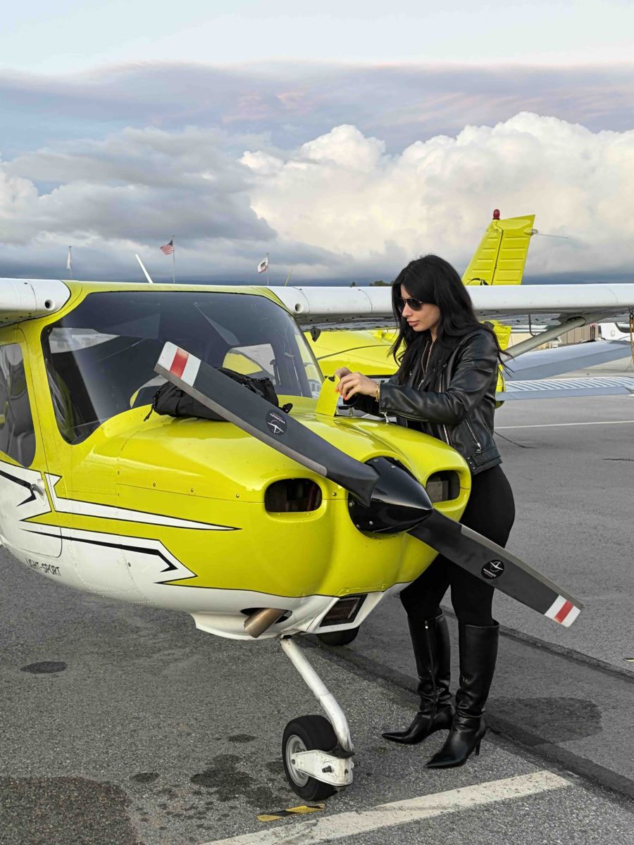 Pre-flight walk-around beside the Cirrus