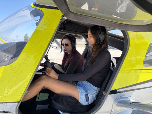 Two friends in the cockpit before a 90-minute discovery flight for two over Downtown Los Angeles