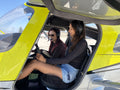 Two friends in the cockpit of a training airplane before a discovery flight for two over Downtown Los Angeles