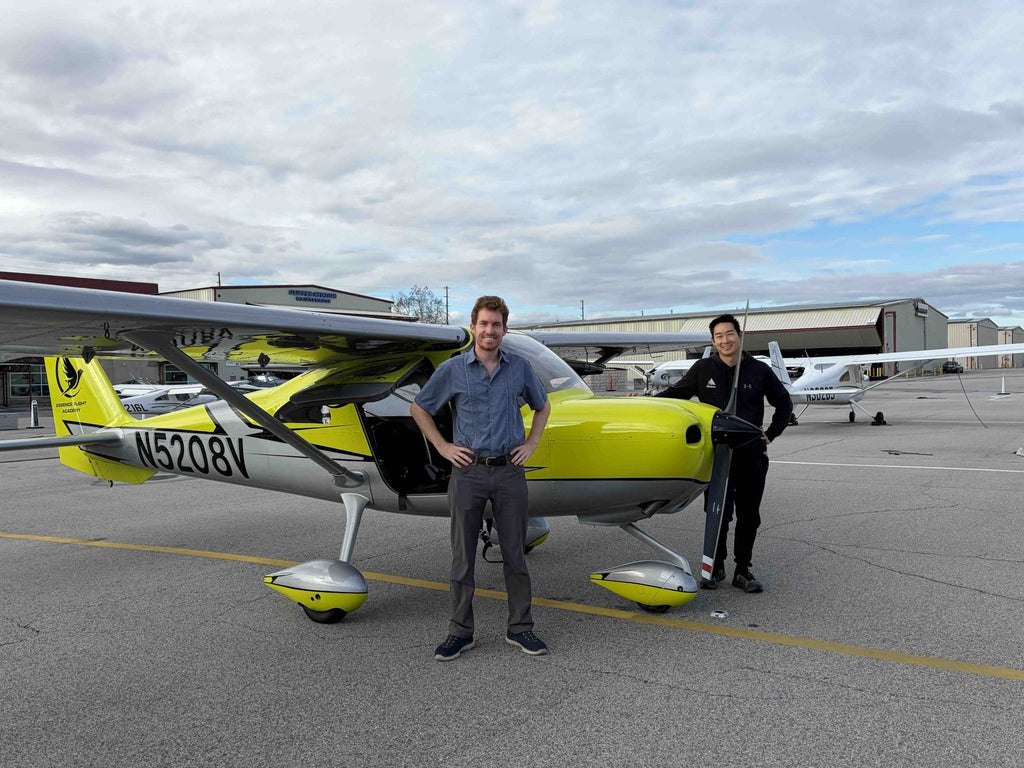 Couple with their instructor beside the airplane at Van Nuys Airport before a discovery flight for two