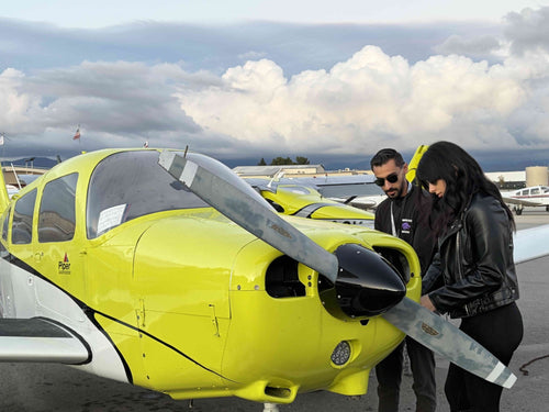 Instructor and student beside a Piper Warrior before a discovery flight at Van Nuys Airport, Los Angeles