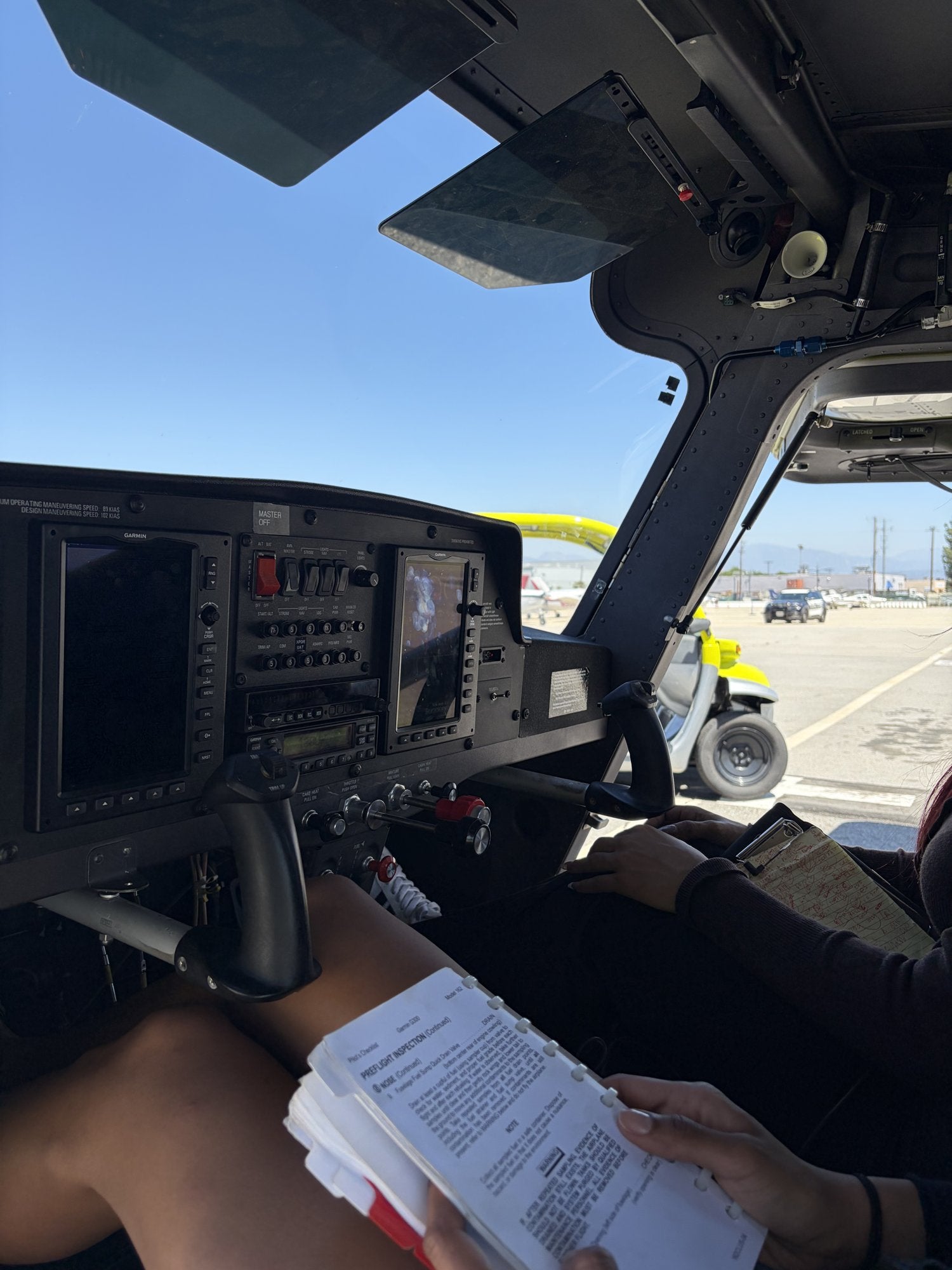 Student's hands on the flight controls during the airwork segment of a 90-minute discovery flight