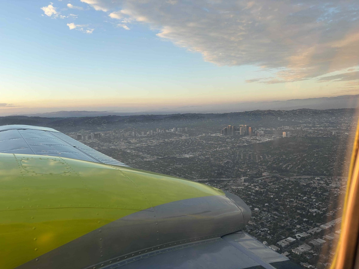 View of Los Angeles from the cockpit window during a discovery flight at sunset