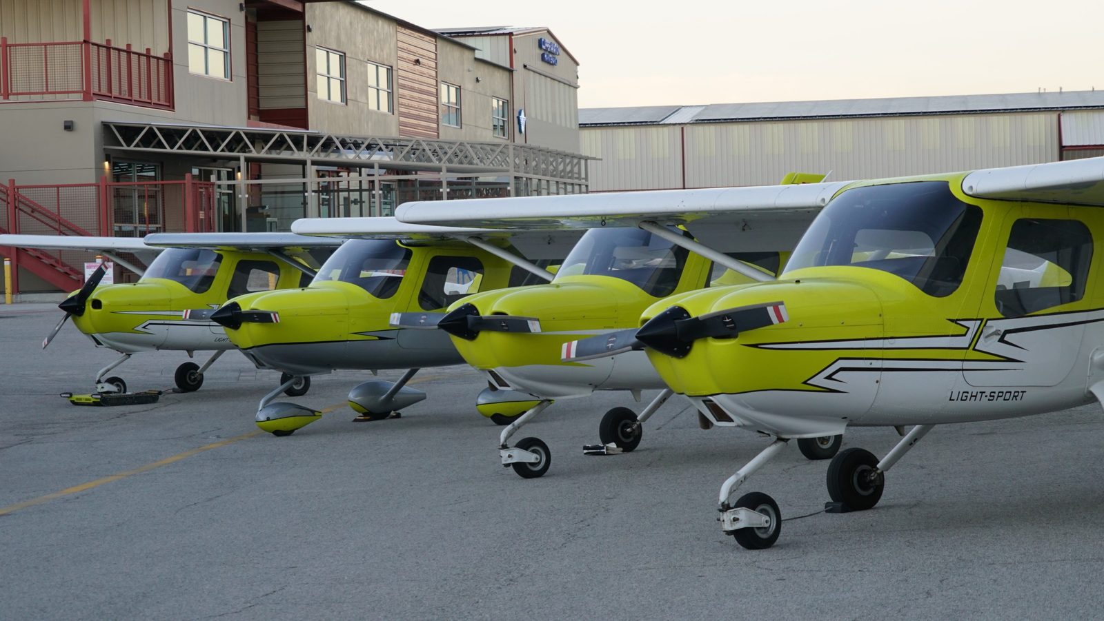 A row of You Fly LA's Cessna 162 Skycatchers lined up at Van Nuys