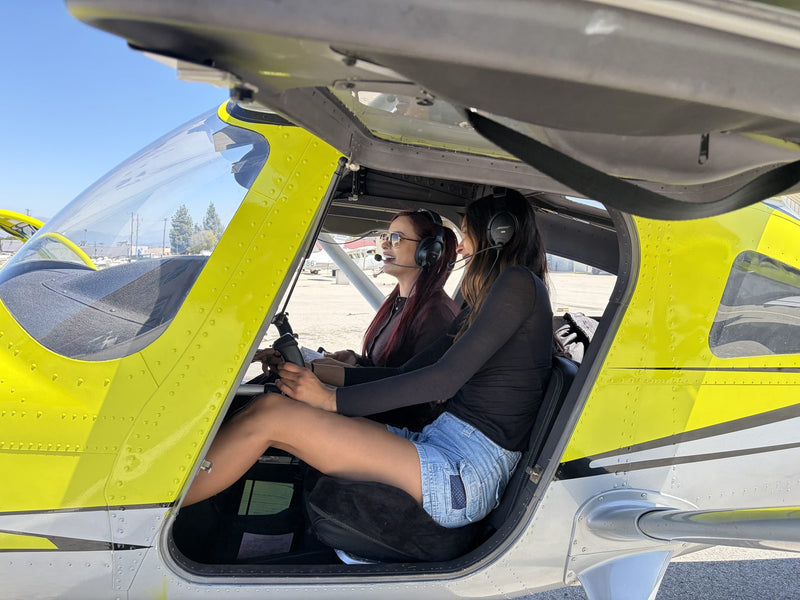 Instructor briefing a student in the cockpit during presolo private pilot training